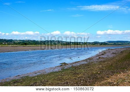 View across the River Axe towards the surrounding countryside Axmouth Devon England UK Western Europe.
