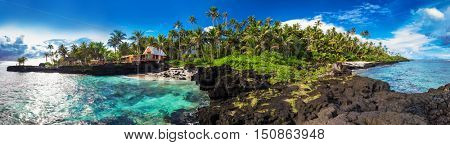 Panoramic view of coral reef and palm trees on south side of Upolu, Samoa Islands.