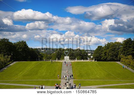 EDITORIAL OSLO NORWAY - AUGUST 18 2016: Many tourist walk Vigeland Sculptures Park in the popular Vigeland park ( Frogner Park ) designed by Gustav Vigeland in Oslo Norway on August 18 2016.