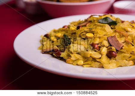 homemade tasty Diwali food or Diwali snacks or Diwali sweets like rava laddu, chakli, sev, shankar pale and chivda or chiwada with dry fruits in white bowls, favourite indian diwali recipe
