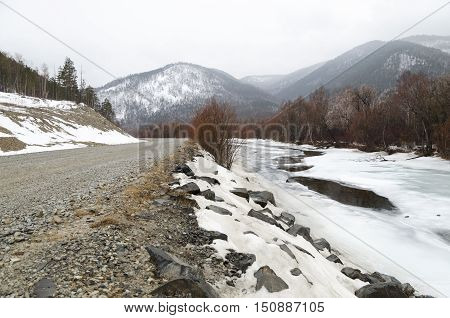 Icebound River On A Cloudy Spring Day. Irkutsk Region