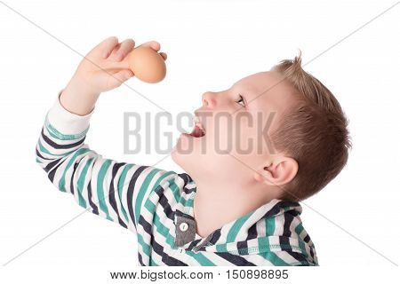 Young Boy Play The Eggs Over The White