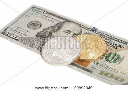 Golden and Silver bitcoin coins and one hundred dollar banknote isolated on white