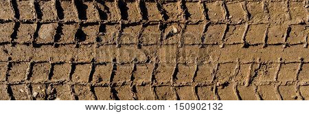 Tire tracks on the ground, texture of the soil, soil texture, nature background, ground, tire tracks, car tracks, ground texture