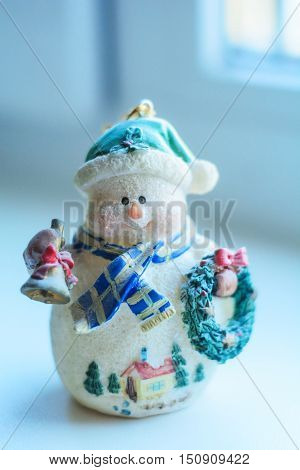 figure Christmas snowman with bell in hand