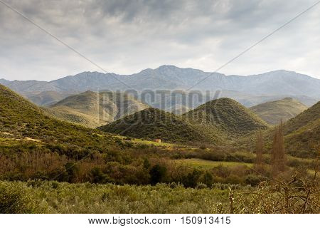 Green Valleys With Mountains In The Background