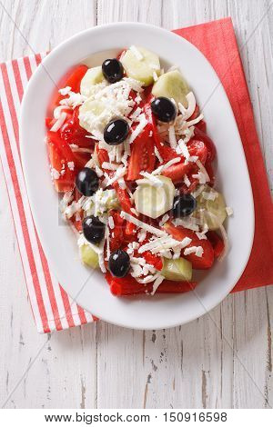 Bulgarian Cuisine: Shopska Vegetables Salad With Feta Closeup On A Plate. Vertical Top View