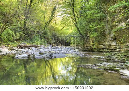 Mountain small river Agura in an of the same name canyon