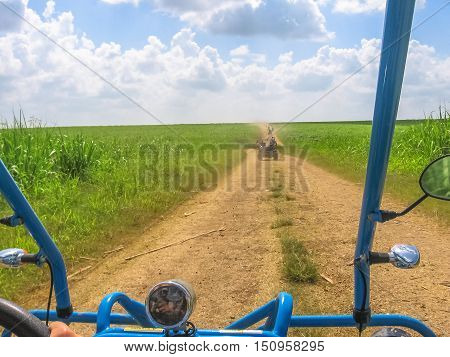 Dirt road of Cumayasa area, near La Romana and Catalina Island, from the Buggy. Enjoy the landscapes of Dominican Republic during a Buggy ride. The Buggy ride is a popular excursion in Cumayasa area.