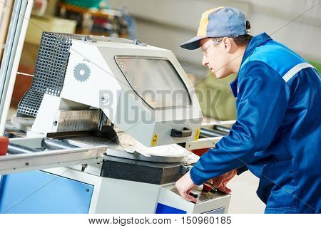 industrial worker with buzz saw circular blade for cutting metal