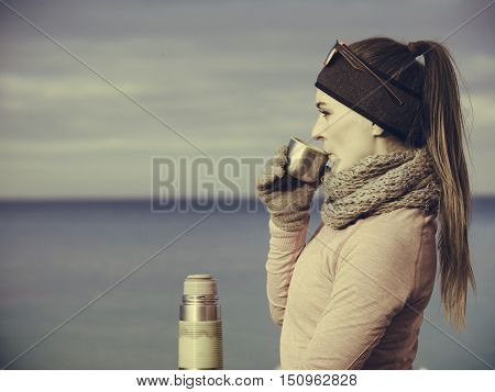 Fit Woman In Cold Day Warming Up Drink Tea