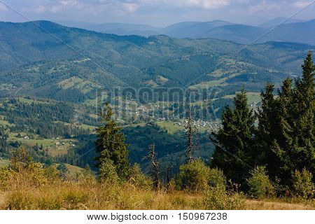 Hill In The Carpathian Mountains. View To The Village.