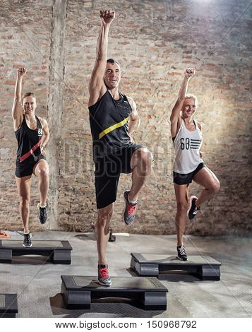 Aerobics class, group of people doing workout 