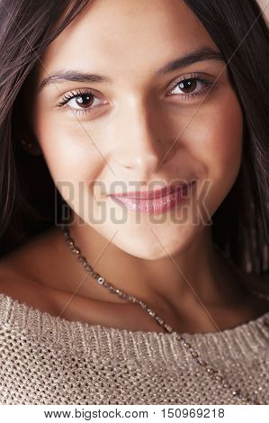 young pretty taned girl close up portrait smiling confident brunette warm, lifestyle real people concept
