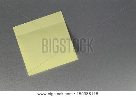 Empty yellow paper sheet on refrigerator door for design and input text to concept food and drink etc.