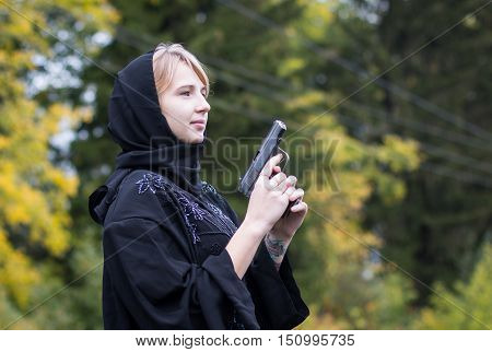 Muslim Woman With Arms In Autumn Day