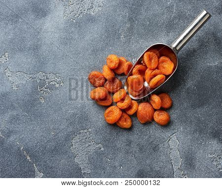 Dried Apricots On Gray Background. Witn Copy Space. Top View.
