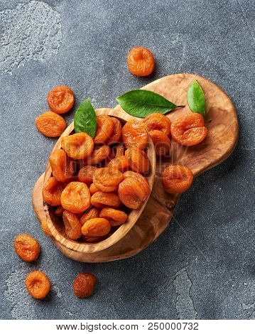 Dried Apricots On Gray Background. Top View.