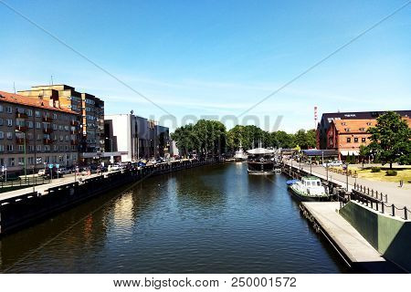 Cityscape Of Industrial Eastern European City With River And Blocks Of Houses