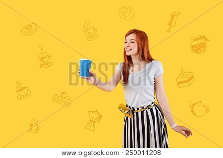 Hot Tea. Positive Experienced Waitress Smiling And Looking Cheerful While Being At Work And Holding 