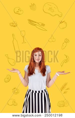 Difficult Choice. Pretty Young Cook Smiling And Putting Her Hands Up While Thinking About Her New De