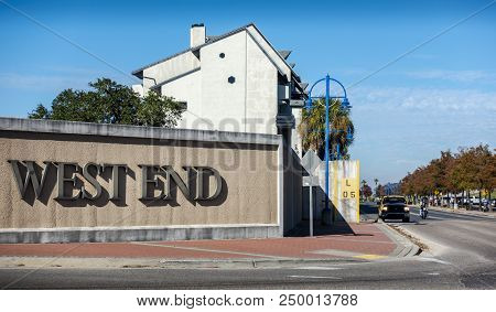 New Orleans, Usa - Nov 26, 2017: Entry To The West End Area. Biker And Pick-up Truck Along Lakeshore