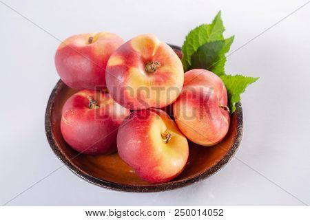 New Hybrid Sweet Fruit Nectarina Platerina, Flat Saturn Or Donut Nectarine Peaches Close Up