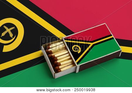 Vanuatu Flag  Is Shown In An Open Matchbox, Which Is Filled With Matches And Lies On A Large Flag.