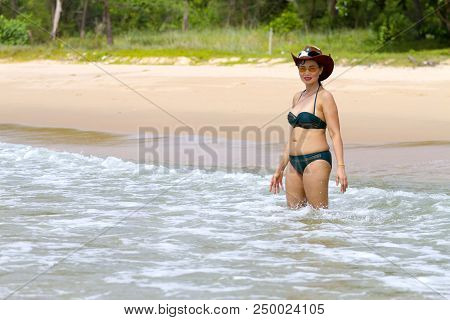 Woman Show Body Pretty With Bikini Hat And Wave On Beach At Bang Beot Beach, Chumphon Province Thail