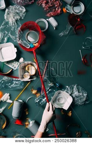 Cropped Shot Of Woman In Latex Glove With Butterfly Net Cleaning Water From Rubbish