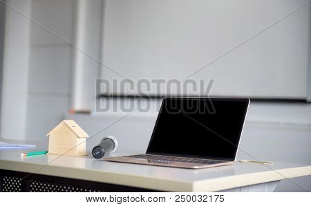 Laptop On The Table In The Meeting Room. Fintech And Technology