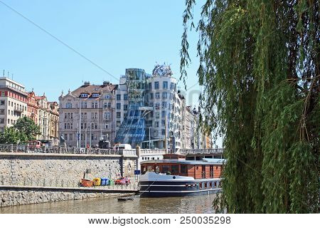 The Old City Of Prague Czech Republic With Vltava River, Ship, Dancing House, Embankment And A Blue 