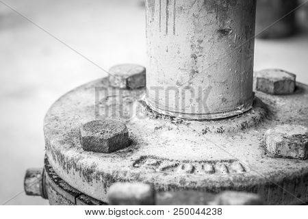 Rust Bolt In Coupling Of Industrial Water Pump. Old Water Pump With Rust Bolt. Heavy Duty Water Pump