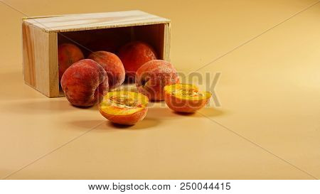 Sweet Peaches Scattered From The Wooden Box. Peachy Background. Fresh Peach Concept. Flat Lay. Copy 