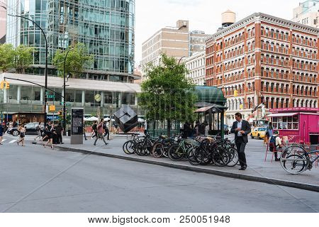 New York City, Usa - June 20, 2018: Street Scene In Cooper Square With People Crossing And Bicycles
