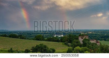 Colorful Rainbow And Storm In The Sky Above Bordeaux Vineyard