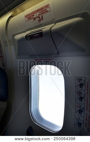 Emergency Exitin  Aircraft Cabin of the Nordica liner during the flight Tallinn-Oslo. June 13,2018. Tallinn,Estonia
