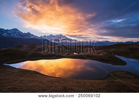 Mountain Lake. Beautiful sunrise. Morning landscape.  Koruldi Lake. Main Caucasian ridge. Zemo Svaneti, Georgia 
