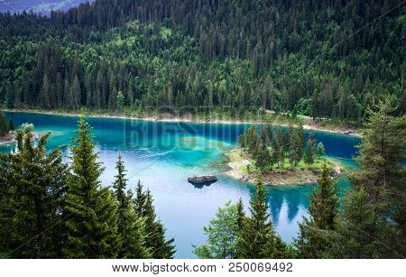 Caumasee Lake With A Small Island Located In The Middle Of The Crystal Clean Lake, Near Flims, Switz
