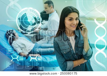 Calm Phone Talk. Cheerful Young Woman Talking On The Phone And A Professional Doctor Making An Elect