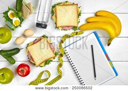 Top View Planning Notebook With Copy Space And Healthy Breakfast. Sandwich With Ham And Cheese, Eggs
