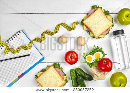 Top View Planning Notebook With Copy Space And Healthy Breakfast. Sandwich With Ham And Cheese, Eggs