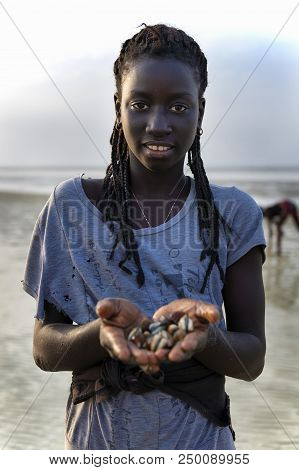 Orango Island, Guinea-bissau - February 2, 2018:  Portrait Of A Beautiful Young Girl At The Beach In