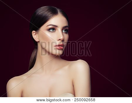 Sexy Woman On Brown Background. Fashion Model With Perfect Makeup And Nacked Shoulder