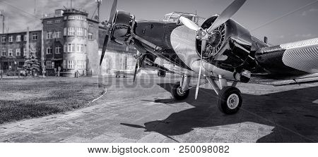 Historical Aircraft On An Airport In Black And White