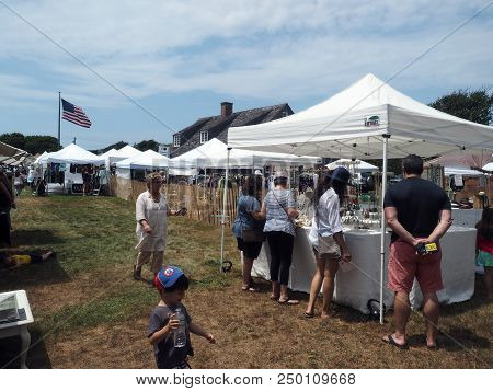 Montauk, New York-july 14: Shoppers Are Seen Looking At Artists And Artisans Crafts At The Montauk H