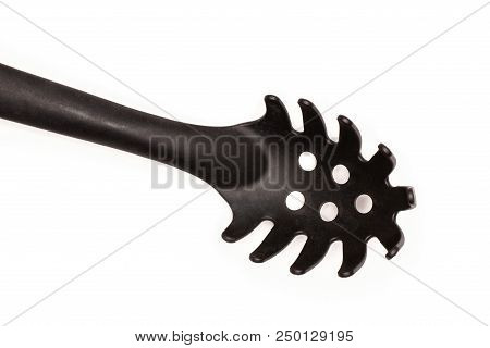 One Whole Kitchen Tool Black Plastic Nylon Spaghetti Spoon Flatlay Isolated On White
