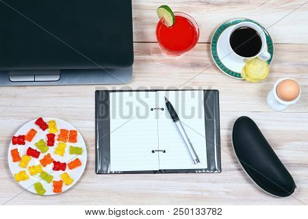 Designer Breakfast And Empty Notepad.  Cup Of Coffee, Juice, Crispy Potato Chips, Glasses Case, Note