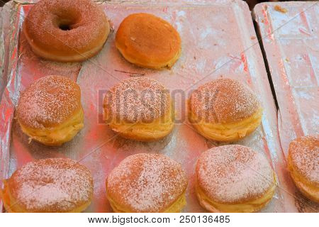 Berliner Bollen With Jam Over A Tray