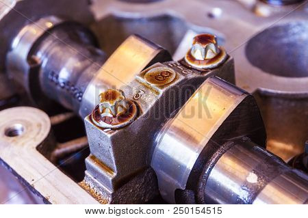 Camshaft And Valve In Oil On The Car Engine, Close-up